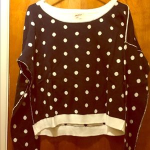 Navy sweater with white polka dots.